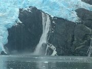 Alaska Waterfall Crashes Into Icy Waters