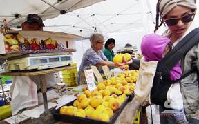 Buying Fruit at an Open Market in Slow Motion
