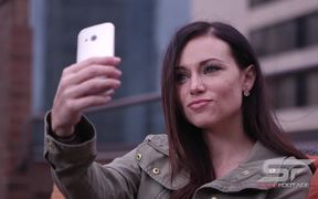 Woman Taking Picture of Herself with Smartphone
