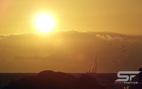 Static View of Sailboat on the Horizon at Sunset - Fun - VIDEOTIME.COM
