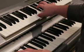 A Musician Plays a Piano and Key Board
