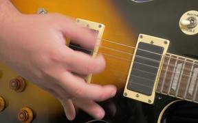 Fingers Picking a Guitar Close Up in HD