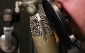 A Singer Singing in a Sound Booth Close Up - Tech - VIDEOTIME.COM