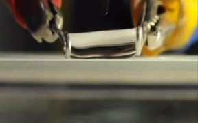 Knife Cutting Water Droplet in Half