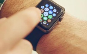 Man Using and Wearing Apple Smart Watch